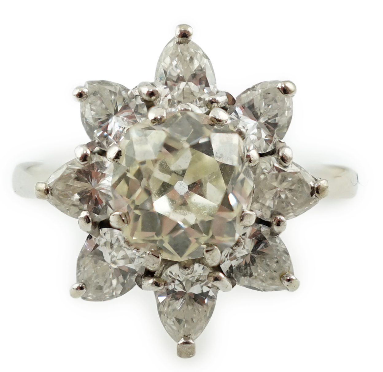 A modern 18ct white gold and diamond flower head cluster ring